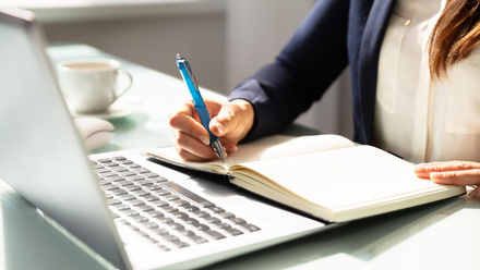 woman writing at computer.jpg