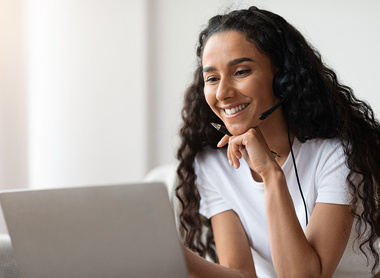 Young woman taking part in online webinar