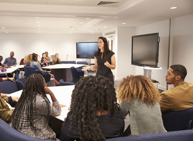 bigstock-Female-teacher-addressing-univ-146034083a.jpg