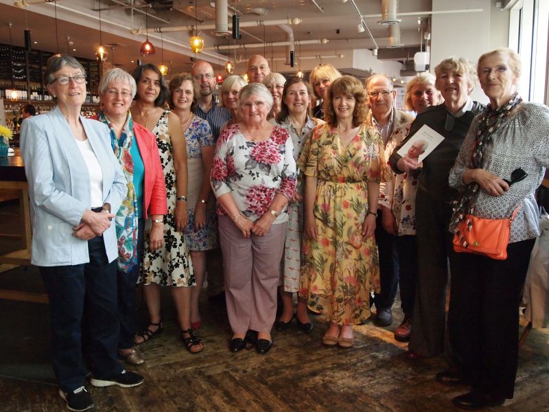 A group of founding members of ITI stand in a line