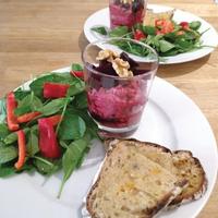 Photo of a plate with two slices of bread, salad and a pot of beetroot verrines